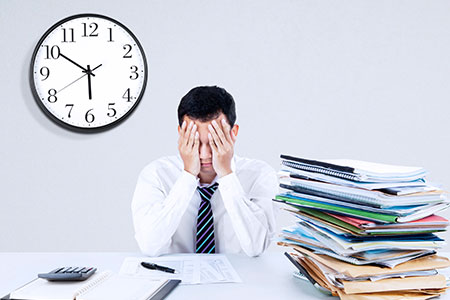 Stressed Employee in Need of Invoice Factoring to Manage Invoices 